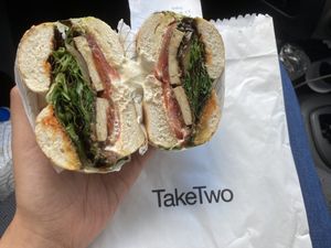 #7 Smoked tofu, charred Eggplant, vegan cream cheese, onion jam, harissa and leafy greens.   at Take Two in Brunswick East