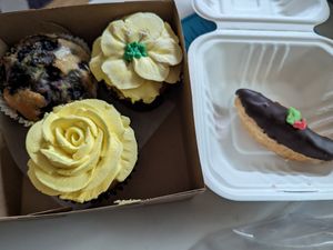Blueberry muffin, vanilla & confetti cupcake, & mini eclair at New Moon Vegan in Batavia