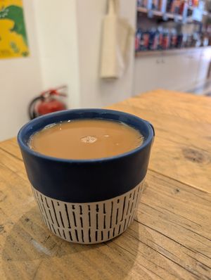 Black tea with splash of oat milk at Bird & Blend in North London