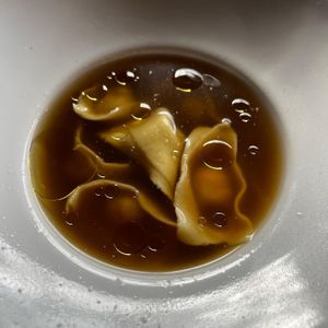 Cappelletti with morel mushrooms in a vegetable brood and topped with truffle oil    at Soda Club in New York City