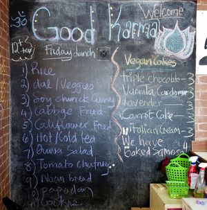Traditional family-style lunch menu (salad, soup, entree, and a cookie...samosas and cake can be added to any meal!) at Good Karma Cafe in Gulfport