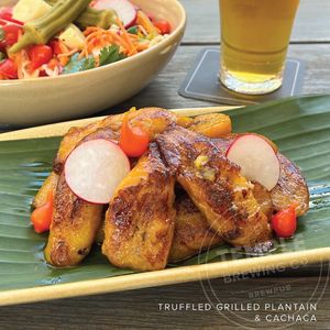 Grilled Plantain “banana da terra” flambeed w/ cachaça liquor drizzled
with truffle oil.  at Temple Brewpub  in Brunswick East