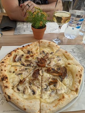 Mushroom pizza with vegan cream. at Artisti in Corfu