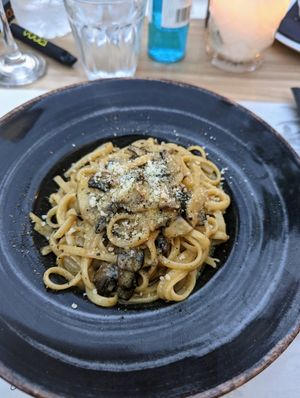 Mushroom linguine with vegan parmesan!! 10/10 at Artisti in Corfu