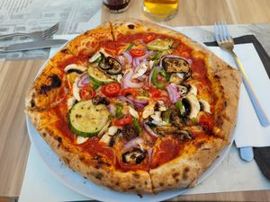 Vegan pizza with mixed vegetables and extra cheese at Artisti in Corfu