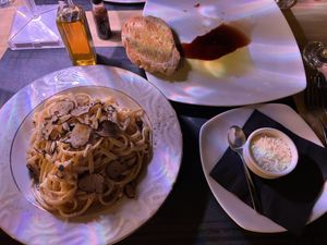 Truffle Linguini, Garlic bread and a side of vegan parm. ALL 100% vegan and 100% delicious!  at Artisti in Corfu