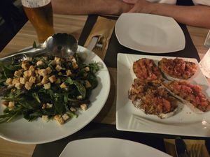 Italian bruschetta and the restaurant's special salad at Artisti in Corfu
