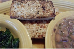 Grilled marinated tofu, pinto’s and sauted kale    at Tupelo Honey in Greenville
