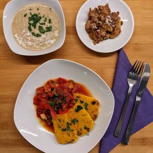 White bean soup,
Crispy polenta with tomato-tofu ragout and apple crumble at Sattva Vegan in Vienna