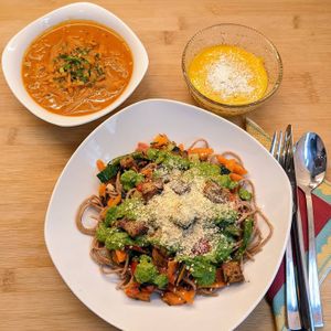 Hungarian cabbagesoup, Spaghetti with tahini-parsley-pesto und sauteed veggies, fried tofu und almond-parmesan, 
mangopudding with coconutshavings at Sattva Vegan in Vienna