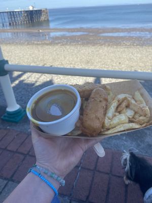 Vegan chips, curry sauce and battered sausage   at Beachcliff Fish & Chips in Penarth