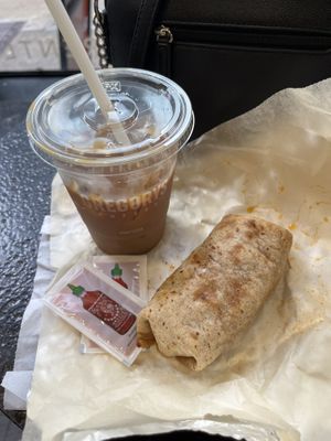 The “Hall & Oat” cold brew (cinnamon, vanilla, oat milk) plus the vegan burrito  at Gregory's Coffee - 6th Ave in New York City