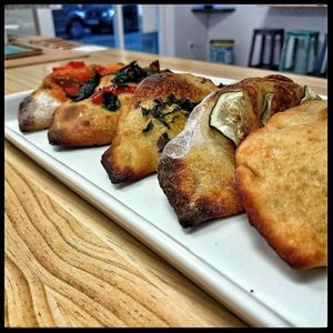 Calzoni made with natural sourdough and homemade cheese  at La Cosa Vegana in Granada