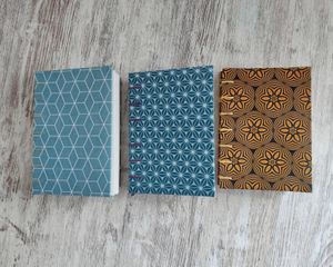 Coptic stich notebooks, handmade covers with organic cotton, hand binded with different paper inside at La Cosa Vegana in Granada