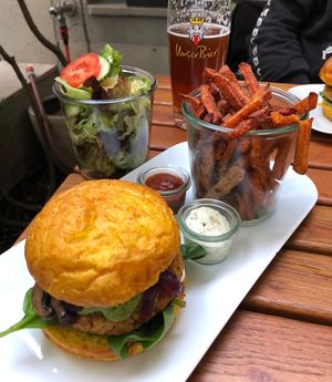 “Green Day Vegan” burger with sweet potato fries, homemade dips and salad 😋 at La Manufacture Gundeli in Basel