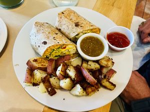Breakfast tofu burrito with home fries  at Three Little Birds Cafe in Charleston