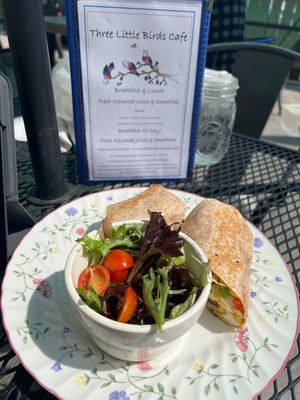 Vegan scramble burrito with vegan cheese and salad  at Three Little Birds Cafe in Charleston