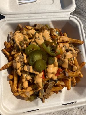 Loaded Goose Fries (philly style seitan, mushrooms, onions, peppers, jalapenos and nacho cheez) at The Grumpy Goose in Duluth