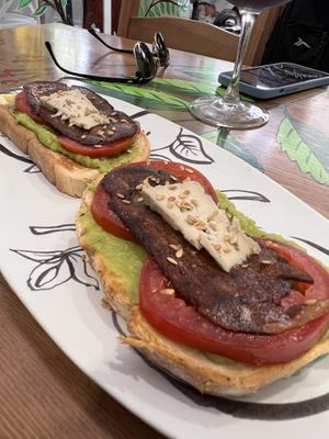 Avocado on toast with tomato, vegan bacon and vegan cheese   at Contracorriente in Ourense