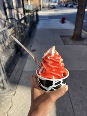 Regular cup with vanilla soft serve and strawberry syrup  at Vaca's Creamery in Chicago