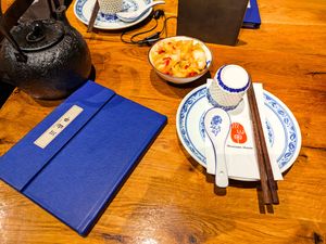 Tea and spicy cabbage that comes before you order at Szechuan Mountain House at Szechuan Mountain House in New York City