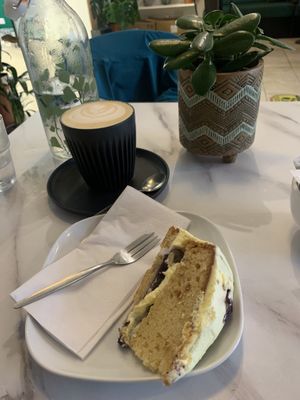 Vegan lemon and blueberry cake and oat milk latte  at Moka  in Ardrossan