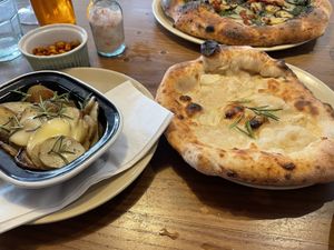 Cheese garlic bread and roasted garlic and rosemary potatoes  at Purezza in Manchester