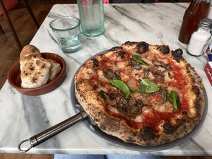 Aubergine pizza and dough balls  at Purezza in Manchester