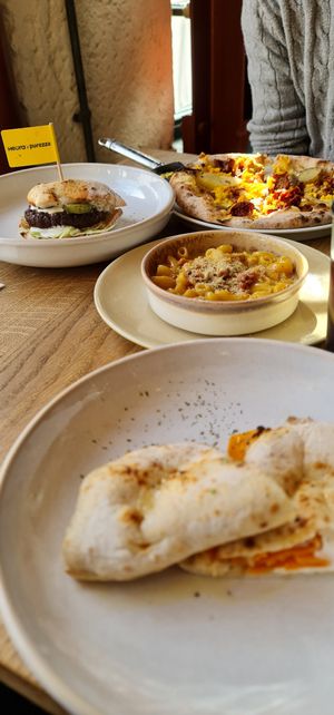 Breakfast pizza, heura burger, mac n cheese, salmon and cream cheese cibatta at Purezza in Manchester