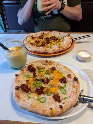 Large breakfast pizza and small Njuda pizza, not much difference in size at Purezza in Manchester