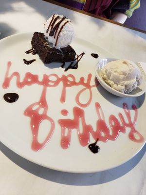 Salted caramel brownie with ice cream. Plus an extra scoop! Wonderful staff decorated the plate for my b day :) at Purezza in Manchester