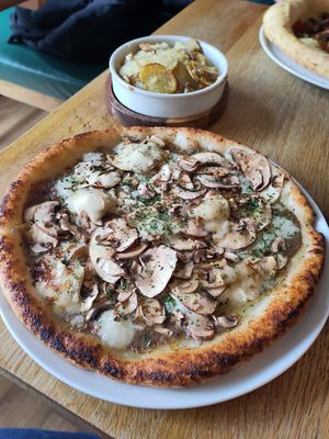 Truffle pizza (gluten free base) and garlic potatoes at Purezza in Manchester