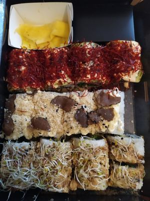 Variety of 3 sushi types with vegan fish and sauce toppings at Loco Sushi in Hamburg