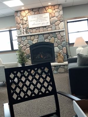 Cafe style seating. Stay warm by the fire. at Nature's Nest in Grayling