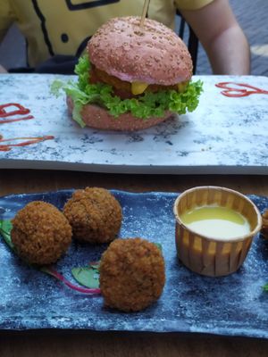 Bitterballen with honey mustard sauce and crispy chicken burger at Vegan Temple Bar in Amsterdam