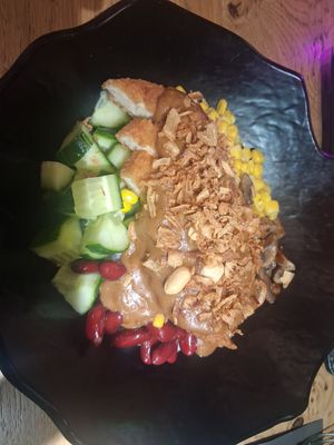 Ch*cken and satay bowl. at Vegan Temple Bar in Amsterdam