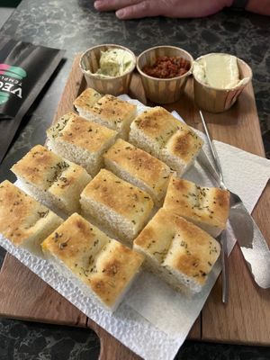 Bread with dips (herb butter 🌱, dried tomatoes tapenade and hummus)  at Vegan Temple Bar in Amsterdam