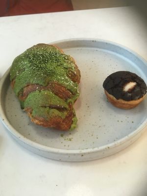 Matcha croissant and a cream puff at Whisk Matcha Cafe in Vancouver