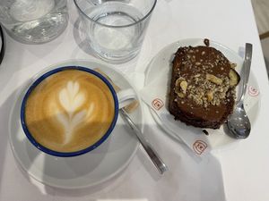 Cappuccino and banana cake 🍰   at Charli's Crew in Paris