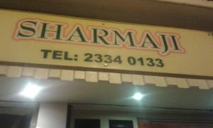 Shop sign at Sharmaji Indian Veggie Restaurant in Kowloon