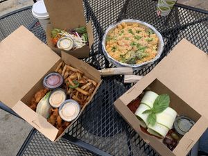 Buffalo cauliflower tacos and jalapeño onion fries with vegan chipotle ranch, house salad, vegan mac and cheese with broccoli, and spinach pesto manicotti😋🌱 at Laughing Seed Cafe in Asheville