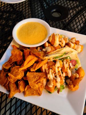 Buffalo tacos with sweet potato chips and a side of queso at Laughing Seed Cafe in Asheville