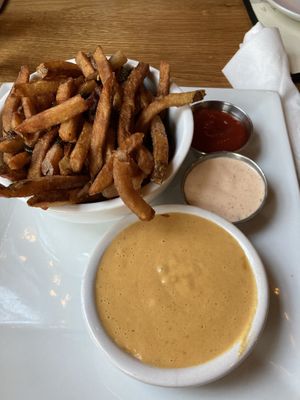 Jalapeño onion fries, vegan queso and vegan chipotle sauce  at Laughing Seed Cafe in Asheville