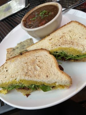 Grilled cheese with arugula, local apple butter, caramelized, onions, and shiitake bacon. With black bean and sweet potato soup! It was phenomenal    at Laughing Seed Cafe in Asheville