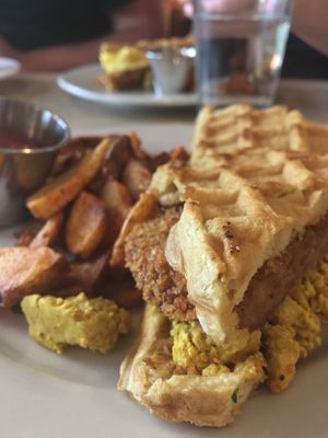 Chikn waffle sandwich made vegan with tofu scramble - amazing!!! at Laughing Seed Cafe in Asheville