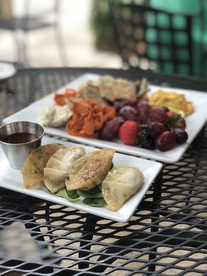 Dumplings and vegan cheese plate  at Laughing Seed Cafe in Asheville