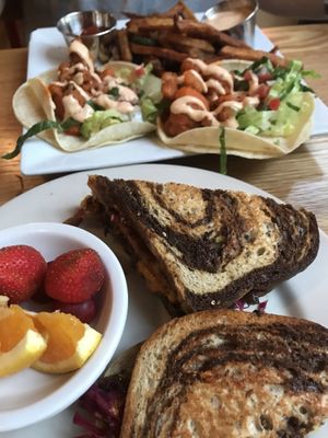 Vegan Ruben with Fruit and Buffalo Cauliflower Tacos with Jalapeño Onion Fries at Laughing Seed Cafe in Asheville