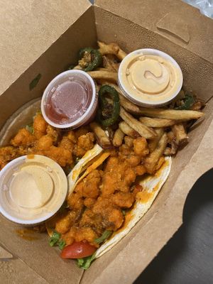 Buffalo cauliflower tacos. Side of jalapeño fries and vegan ranch  at Laughing Seed Cafe in Asheville