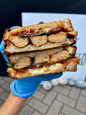Sausage, cheddar and tomato-onion relish toastie at Plant the Seed in Hastings