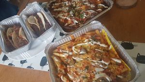 Our takeaway order. Aubergine tacos, Jackfruit tacos, loaded nachos, loaded fries. at La Neta in Preston